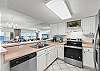 This unit features stainless steel appliances with lots of cabinet & counter space.