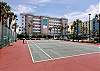 The tennis court is located in the parking lot.  Tennis anyone?