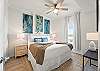 A queen size bed in the guest room.