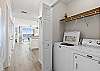 Full size washer & dryer for all your laundry needs.   Store your soaps & dryer sheets on the shelve. 