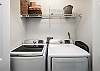 A full size washer & dryer is provided for all you laundry needs. You can store your washing  products on the shelves. 