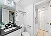 1 and 1/2 featuring the convenience of a divided vanity and tub area!