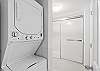 Washer & dryer area, as well as a tub & shower combo. 