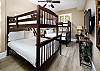 This guest bedroom has two sets of bunk beds and can accommodate 4 guests.