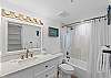 Featuring a tub/shower combo.