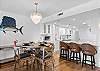 Whether you're preparing fresh seafood, enjoying a leisurely breakfast, or gathering for an evening meal, this spacious kitchen and dining area has everything you need.