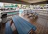 Picnic table located in a covered area by the outdoor pool.