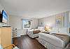 The spacious Guest Bedroom has two QUEEN beds and beautiful tile flooring. A REAL MUST SEE!! 