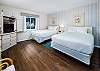 The spacious Guest Bedroom has two QUEEN beds and beautiful tile flooring. A REAL MUST SEE!! 