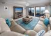 The living area is a great place for entertaining or relaxing. Glass doors lead directly to the 30' private balcony overlooking the beach.