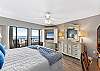 Large balcony doors really let the sights and sounds of the Gulf encompass all of this master bedroom.