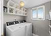 The laundry room is just off the kitchen for your convenience.