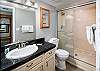 Walk-in shower with sliding glass door for extra convenience