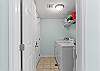 Laundry area has a full size washer and dryer.