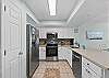 Enjoy cooking in this fully stocked kitchen while enjoying the view