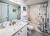 Guest bathroom with nautical themes that run throughout the entire unit.