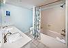 Featuring a shower/tub combo