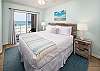 Master bedroom has a king size bed and access to the private beach front balcony.