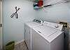 Laundry area has a full size washer and dryer.