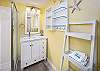 Roomy walk-in shower with STORAGE for personals and again a hair dryer on wall for extra convenience.