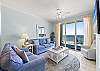A spacious, airy feeling is provided by the open floor plan of the living room, dining area and kitchen.