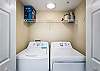 Just behind the kitchen, a full size washer and dryer are available for your convenience.