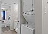 WIth entry to the bedroom as well as a stackable washer and dryer for your laundry needs.