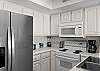 The kitchen has full-size appliances and is stocked with dishes and cooking supplies for all your vacation meal needs.