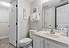 Bathroom facilities by the bunk area, part of the one and half baths in this condo.