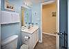 Bathroom facilities by the bunk area, part of the one and half baths in this condo.