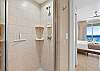 Walk-in shower perfect for a quick rinse before going to enjoy a bite at the local restaraunts.