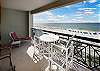 Large balcony with plenty of seating and a dazzling view of the gulf