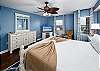 Large dresser with mirror and 37 inch LED TV complete the décor.