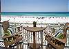 BAR HEIGHT CHAIRS AND TABLE LET YOU LOOK OVER THE RAILING AT THE STUNNING GULF AND BEACH SERVICE. FOUR EXTRA CHAIRS IN CORNER.