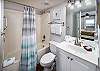 Can be accessed from the hall or the second bedroom. It also features a full tub and shower.