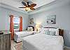 Twin and queen bed in this bedroom.