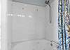 Featuring a jacuzzi tub/shower combo.