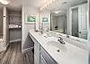 Master bathroom with a large mirror and double vanity; perfect for getting ready for a night out!