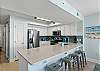 Four guests can enjoy an afternoon cocktail or quick snacks at the breakfast bar