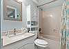 The third full bathroom features a shower  / tub combo as well