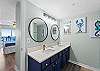Spacious master bathroom with double vanity and a walk in shower.