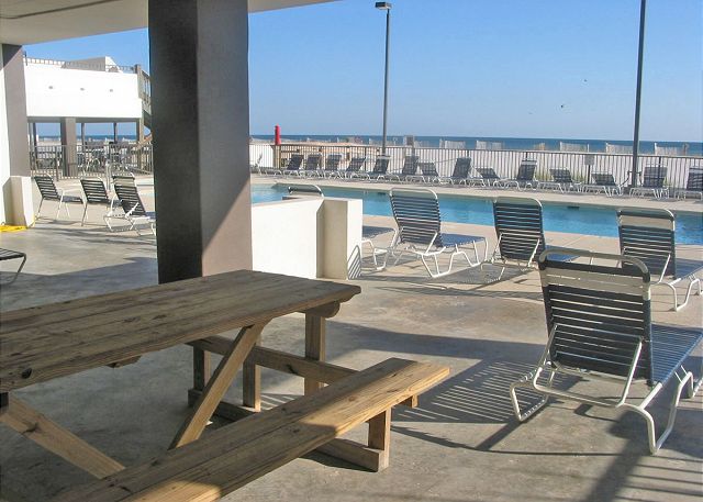 Covered picnic area by pool.