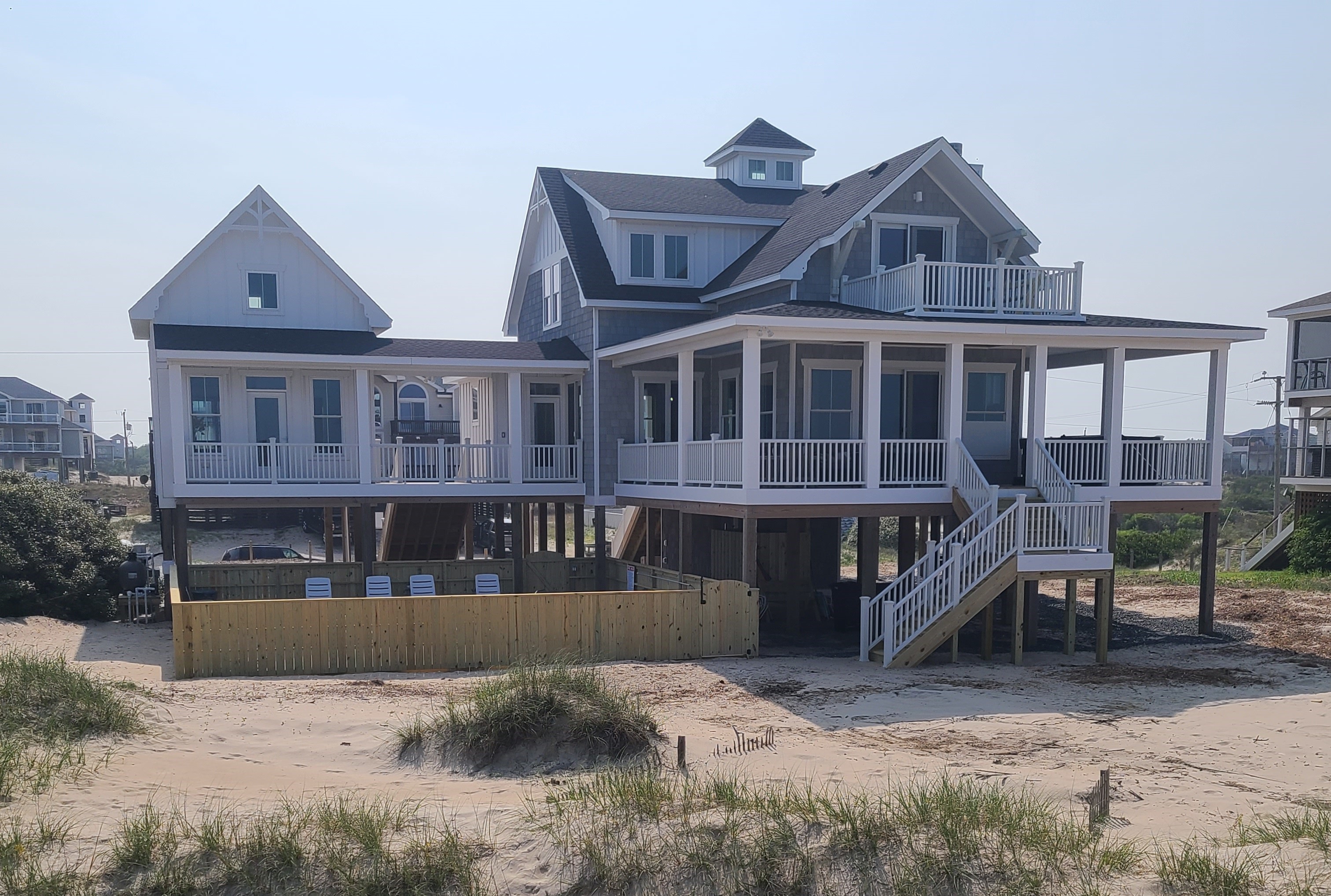 EAST side of the house, pool in front. 
