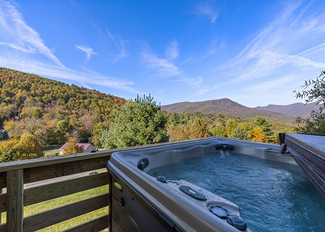 Relax in the hot tub as you enjoy the mountain views.