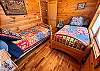 One of two upstairs bedrooms. This one features two twin beds. 