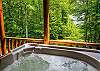 The bubbling hot tub is located off the main level on a spacious covered porch.