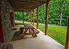 Step outside from the downstairs game room and you will find a picnic table great for a quick lunch or just sitting and relaxing.