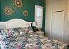 Guest bedroom with Queen Bed with direct pool access. 