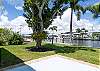 Green backyard with easy access to the canal and surrounding waters of Captiva, Sanibel, and Cayo Costa