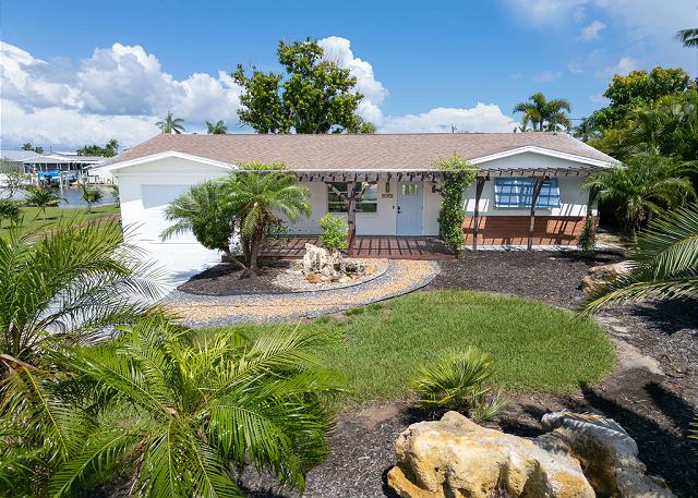 Beautiful lush landscaping welcoming guests to their home. 